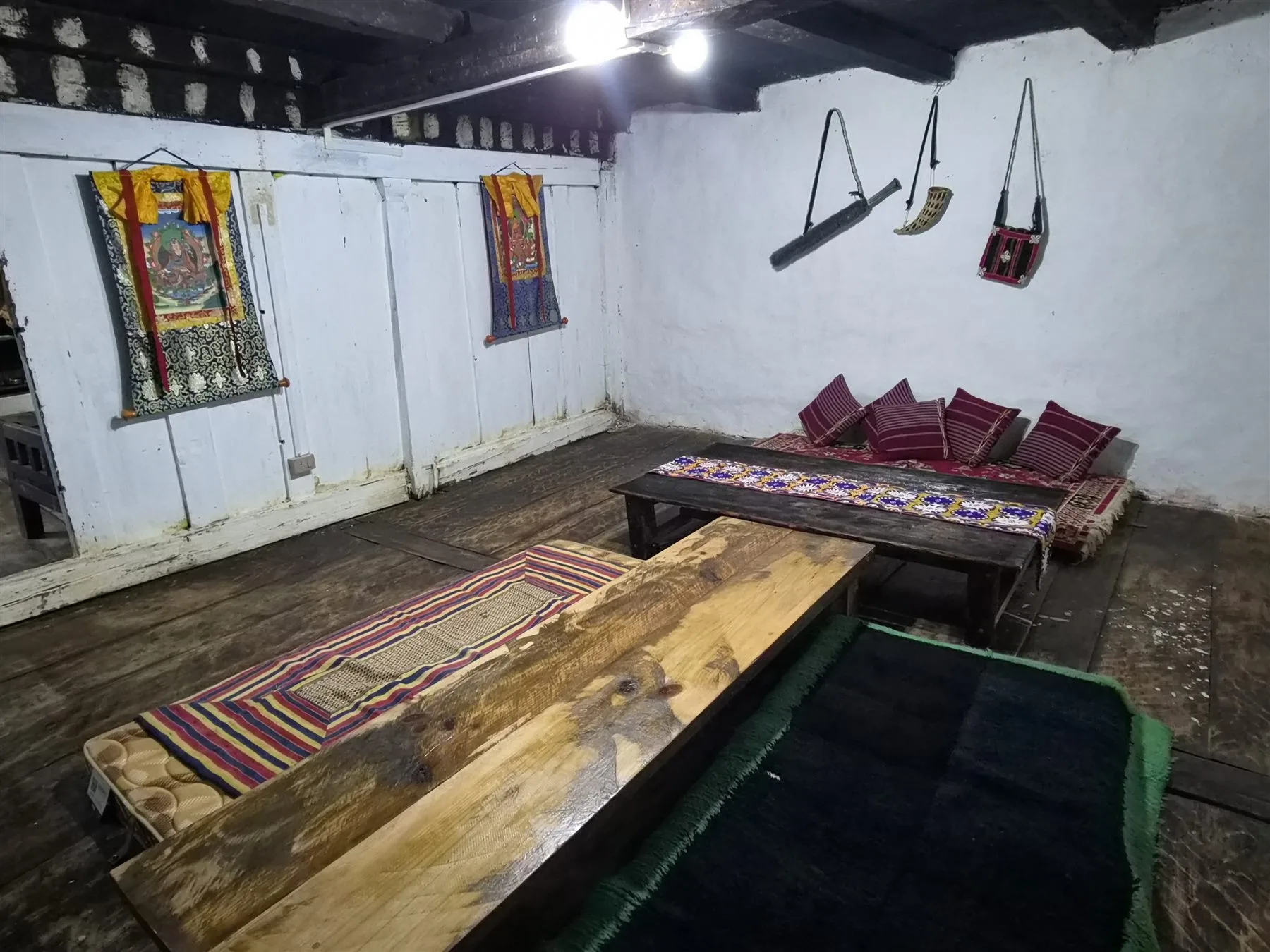 Low wooden tables and floor seating inside Dun Kitchen's heritage dining room